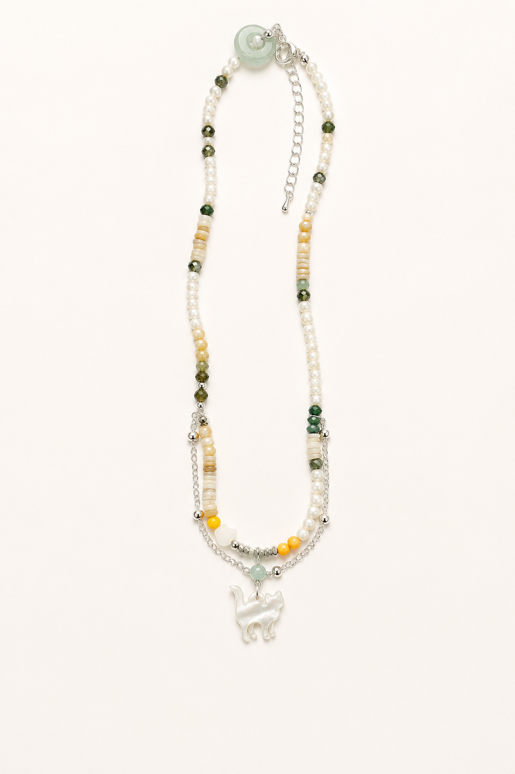 Full view of pearl cat charm necklace featuring natural gemstone beads, silver chain and mother of pearl pendant.